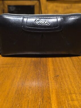 Coach Ashley black leather zip-around wallet. 